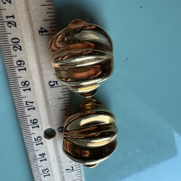 Large gold tone clip on vintage earrings